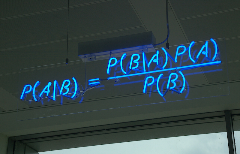 Bayes' theorem spelt out in blue neon at the offices of Autonomy in Cambridge.